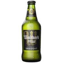 Load image into Gallery viewer, A bottle of Windhoek Draught beer with a black label on a white background.